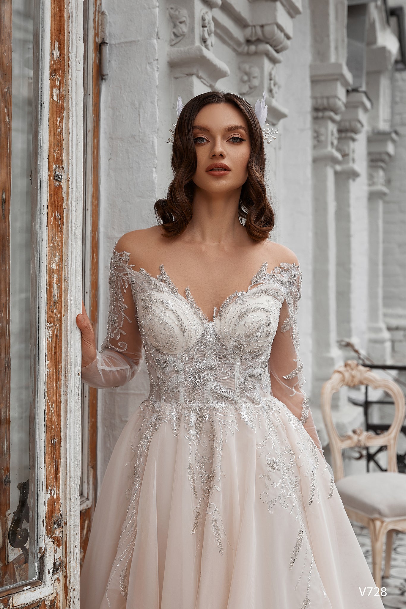 Off the shoulder long sleeve blush wedding dress