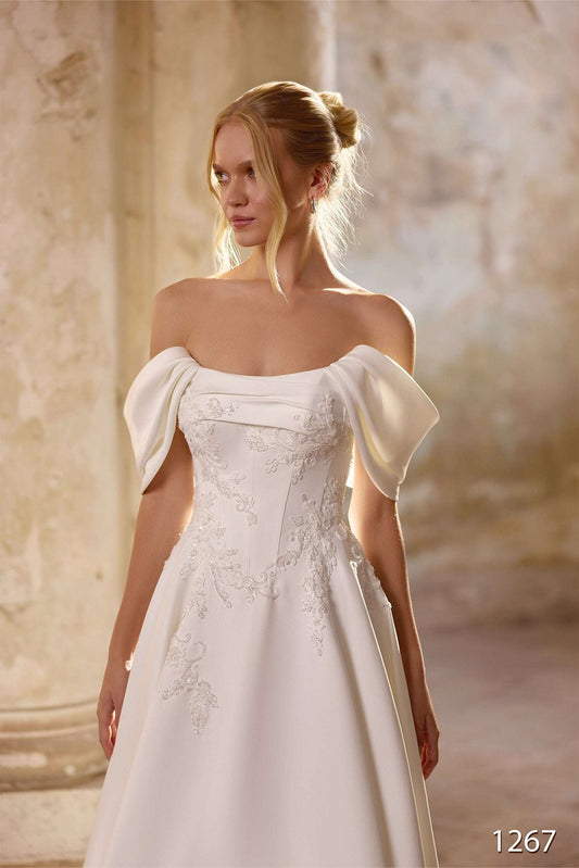 Off the shoulder a line wedding dress with lace appliques and corset bodice by KatrinFAVOR