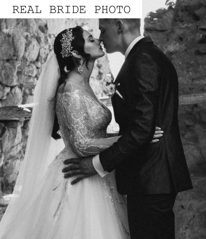 Off the shoulder long sleeve blush wedding dress