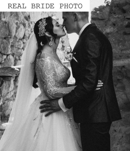 Off the shoulder long sleeve blush wedding dress