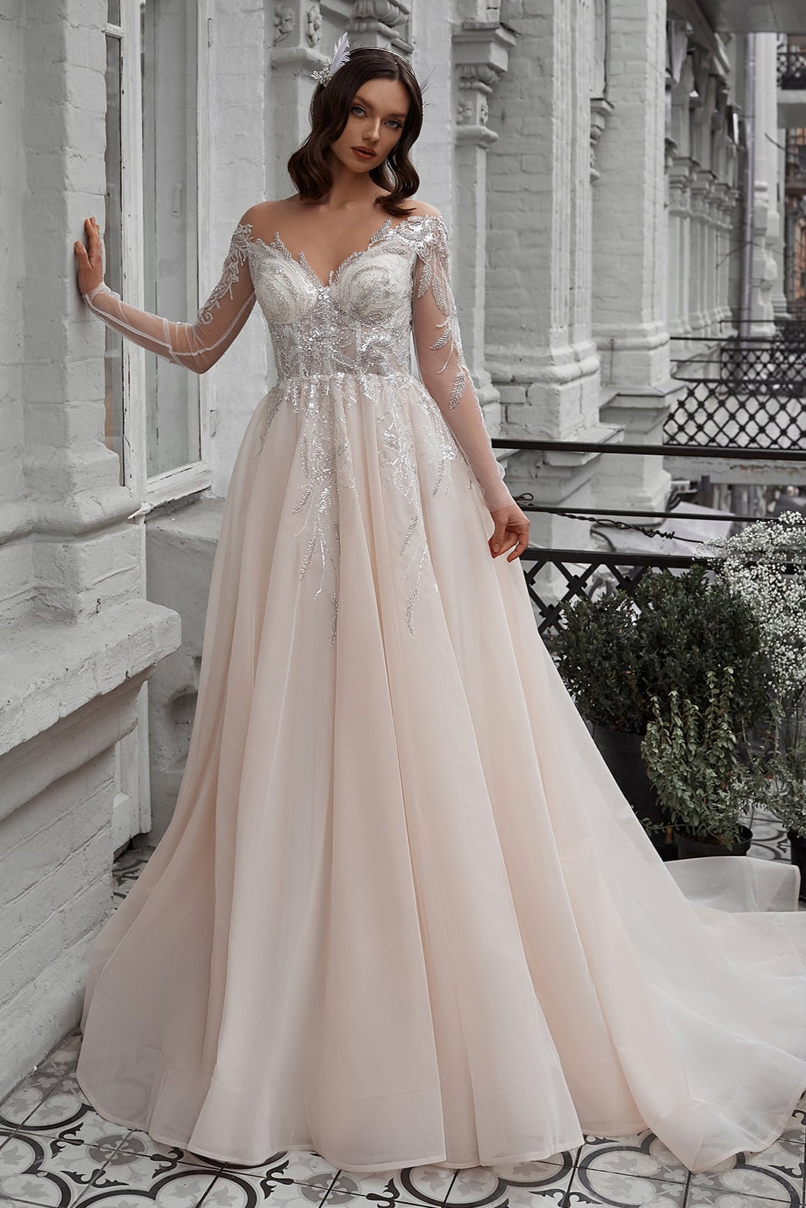 Off the shoulder long sleeve blush wedding dress